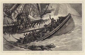 Sulla sabbia, la scialuppa di salvataggio in attesa di un